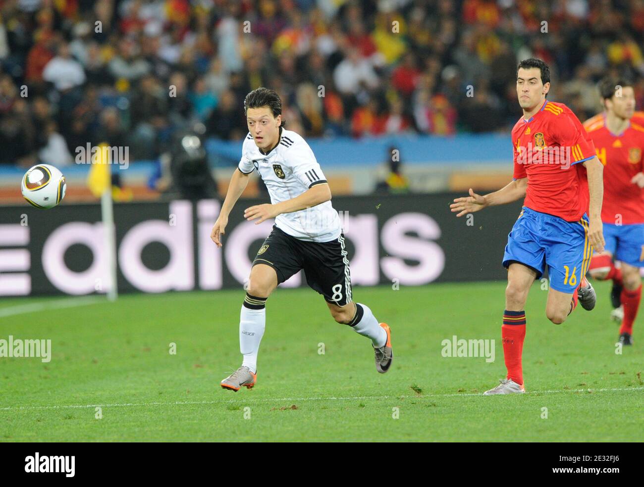 Spain's Sergio Busquets battles for the ball with Germany's Mesut Oezil during the 2010 FIFA World Cup South Africa, Semi-Final, Soccer match, Spain vs Germany at Moses Mabhida football stadium in Durban, South Africa on July 7th, 2010. Spain won 1-0. Photo by Henri Szwarc/ABACAPRESS.COM Stock Photo