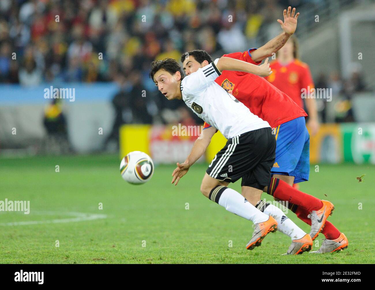 Spain's Sergio Busquets battles for the ball with Germany's Mesut Oezil during the 2010 FIFA World Cup South Africa, Semi-Final, Soccer match, Spain vs Germany at Moses Mabhida football stadium in Durban, South Africa on July 7th, 2010. Spain won 1-0. Photo by Henri Szwarc/ABACAPRESS.COM Stock Photo