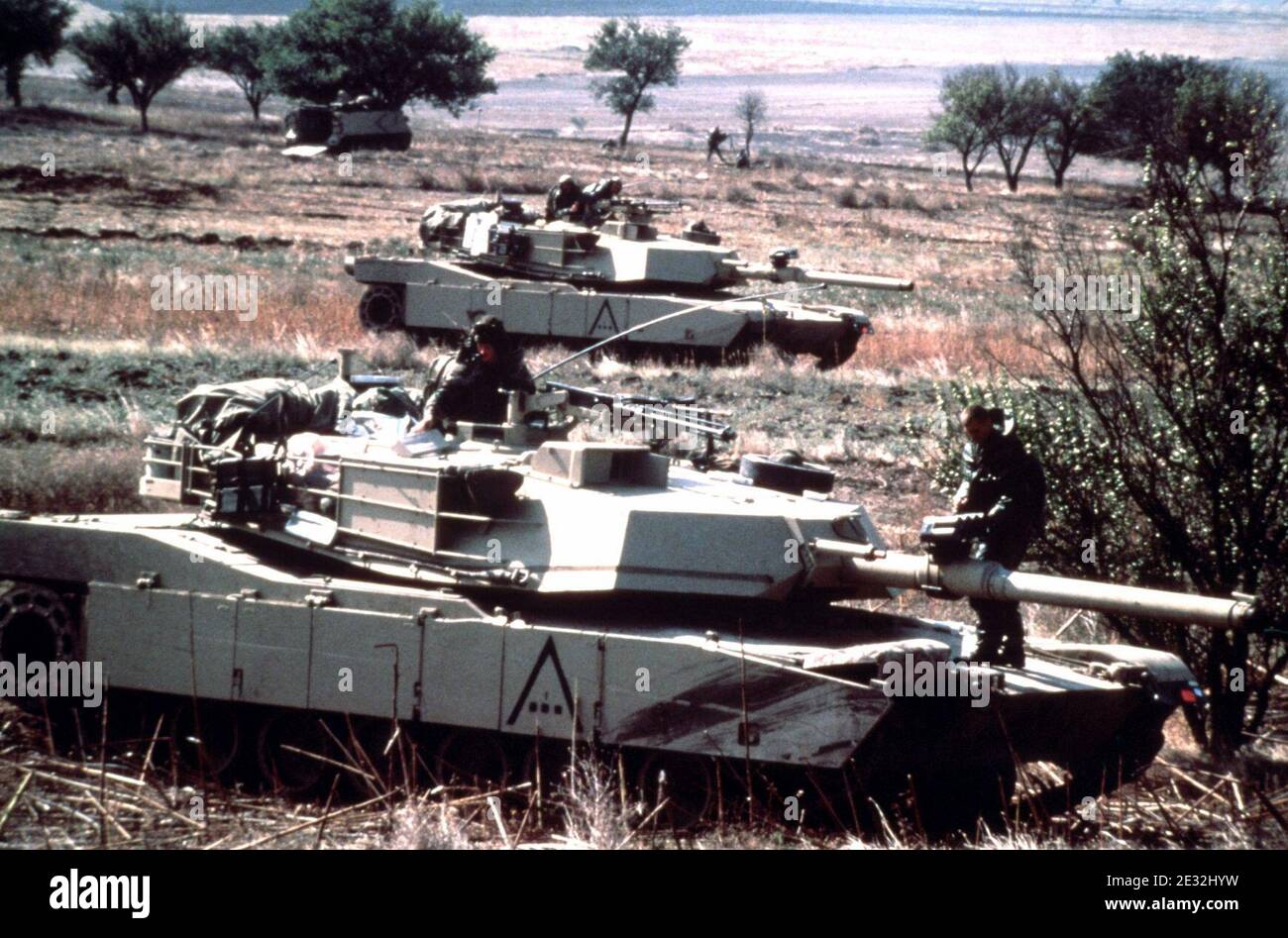 M1 Abrams main battle tanks from the 24th Infantry Division (Mechanized) participate in NATO Exercise DISPLAY DETERMINATION'87 DA-ST-88-05813. Stock Photo