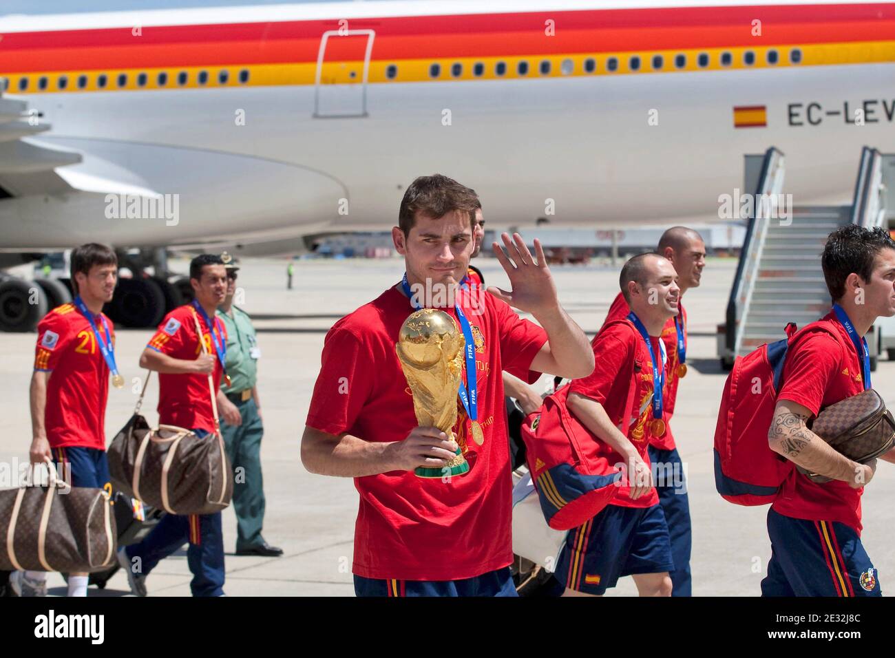 Spain's captain Iker Casillas raises the World Cup trophy as he leaves the aircraft that brought the Spanish team back from South Africa, at Madrid's Barajas airport, in Spain, on Monday, July 12, 2010. Spain won the World Cup after defeating the Netherlands 1-0 on Sunday. Photo by Almagro/Cameleon/ABACAPRESS.COM Stock Photo