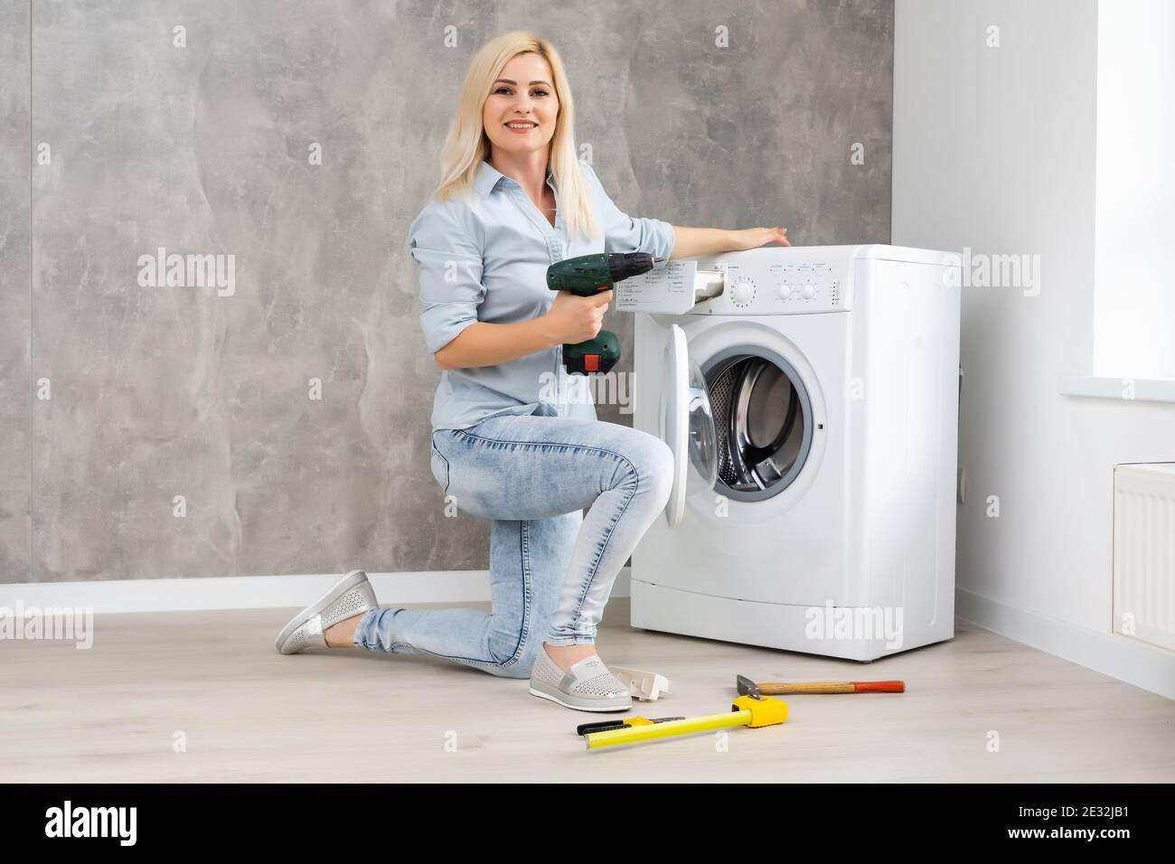 Woman broken washing machine hires stock photography and images Alamy
