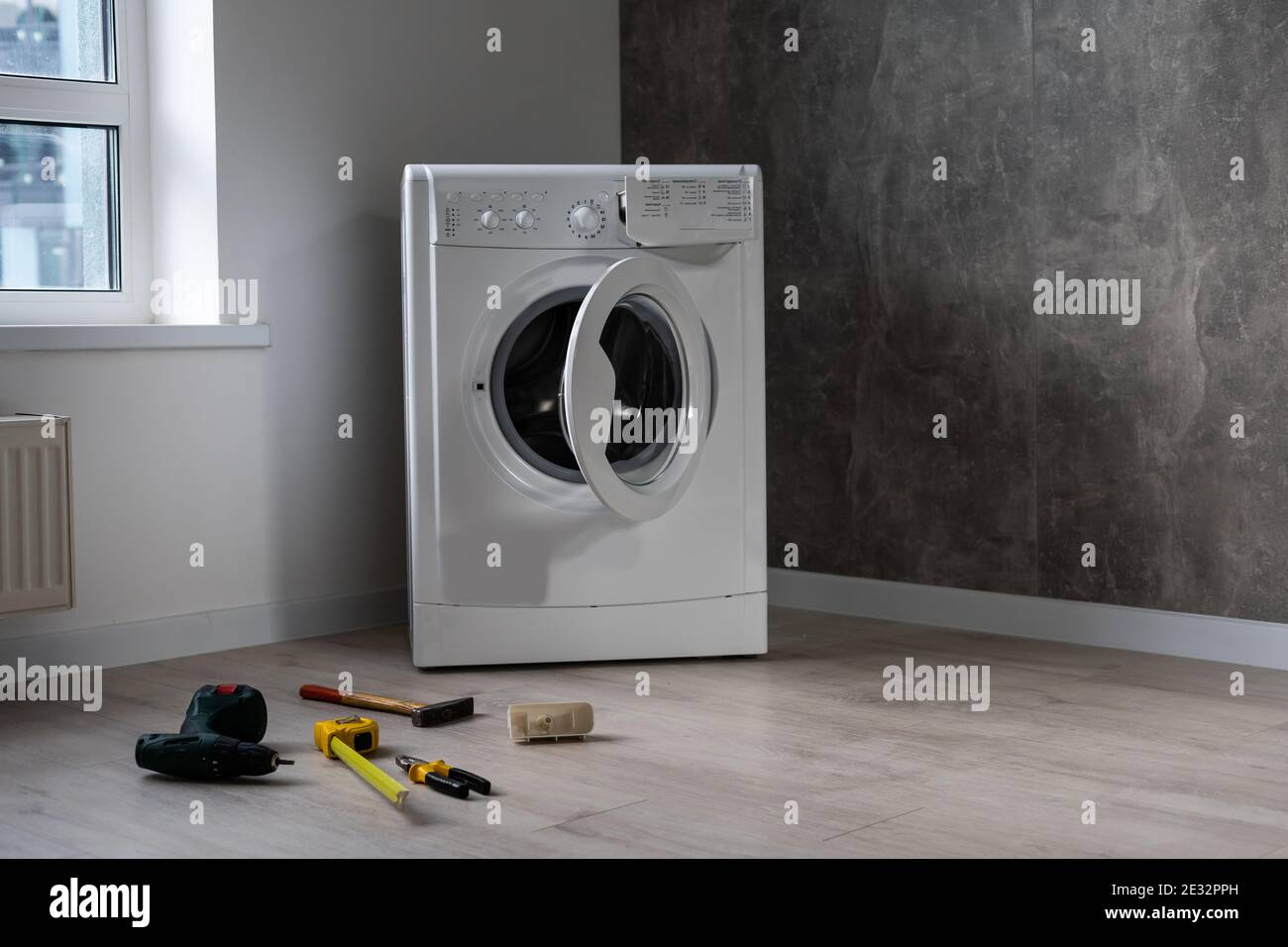 broken washing machine in the apartment Stock Photo Alamy