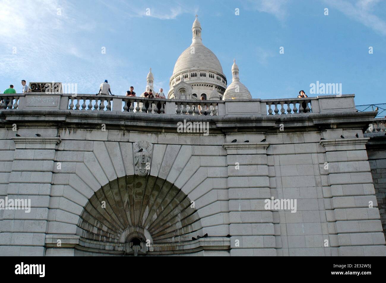 'Illustrations of the white-domed Basilica of the Sacre Coeur in the Montmartre quarter, 18th district of Paris, France, on July 29, 2010. With its many artists setting up their easels each day for the tourists. The Basilica of the Sacre Coeur was built on Montmartre from 1876 to 1912 by public subscription as a gesture of expiation of the ''crimes of the communards'', after the Paris Commune events, and to honour the French victims of the 1871 Franco-Prussian War. Its white dome is a highly visible landmark in the city. Photo by Alain Apaydin/ABACAPRESS.COM' Stock Photo