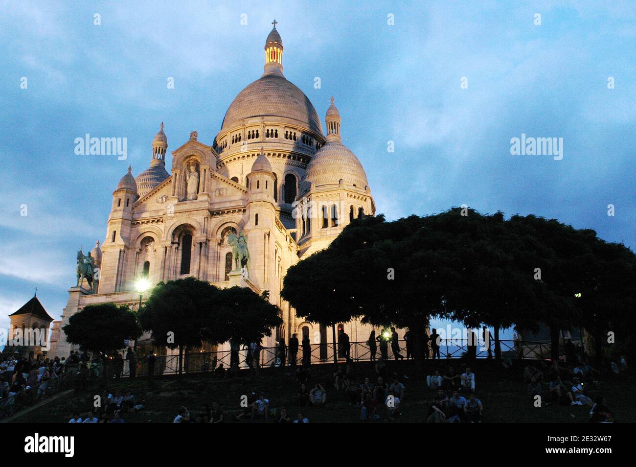 'Illustrations of the white-domed Basilica of the Sacre Coeur in the Montmartre quarter, 18th district of Paris, France, on July 29, 2010. With its many artists setting up their easels each day for the tourists. The Basilica of the Sacre Coeur was built on Montmartre from 1876 to 1912 by public subscription as a gesture of expiation of the ''crimes of the communards'', after the Paris Commune events, and to honour the French victims of the 1871 Franco-Prussian War. Its white dome is a highly visible landmark in the city. Photo by Alain Apaydin/ABACAPRESS.COM' Stock Photo