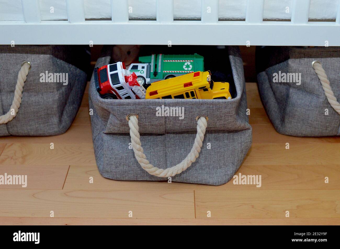 Easy simple home storage solutions for children's play area to clean up toys, games, books, stuffed toys Stock Photo