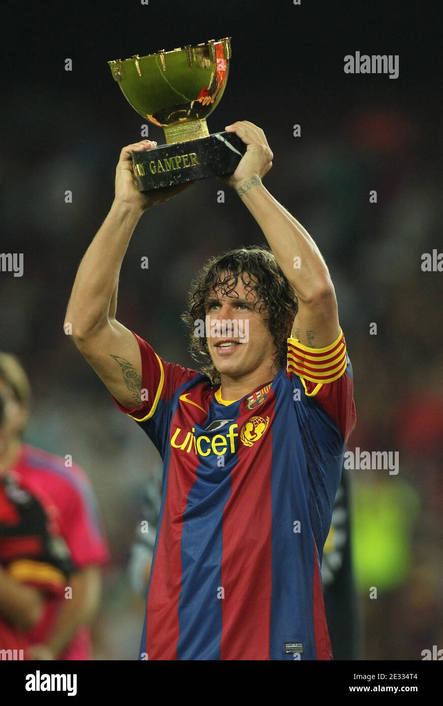 Barcelona's Carles Puyol is seen with the winner cup during the 45th Joan Gamper Trophy Soccer match, FC Barcelona vs AC Milan at Camp Nou in Barcelona, Spain, on August 25, 2010. Photo by Manuel Blondeau/ABACAPRESS.COM Stock Photo