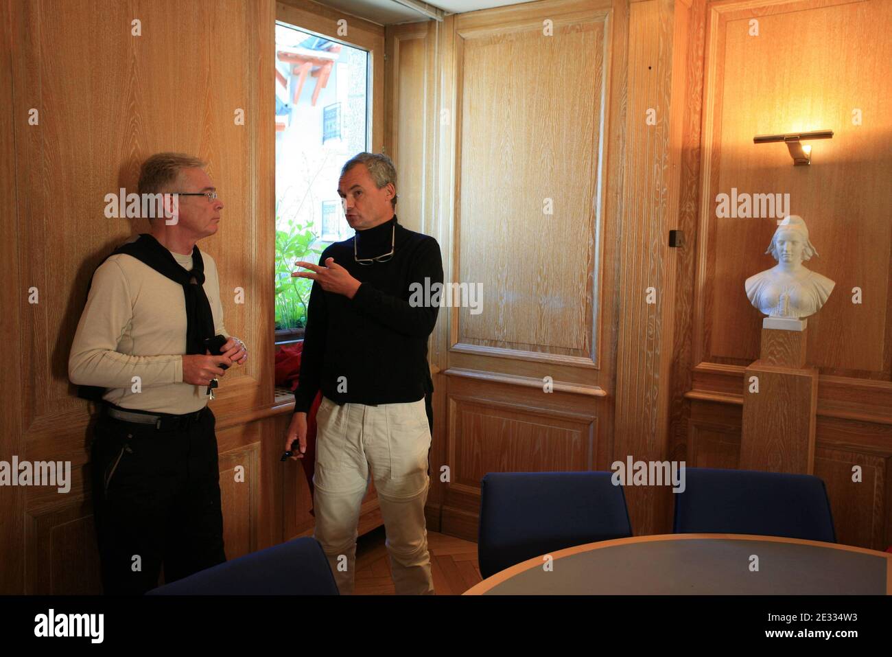 Jean-Luc Videlaine (R), the prefet of Haute-Savoie region and Saint-Gervais mayor Jean-Marc Peillex discuss the situation regarding the Tete-Rousse glacier, at the city hall of Saint-Gervais, southeastern France on August 25, 2010. French engineers began an operation to remove 65,000 cubic meters of water underneath the Tete-Rousse glacier on Mont Blanc. The hidden lake threatens to flood the Saint-Gervais valley, a tourist destination and home to 3,000 people in the French Alps. The engineers are drilling a hole into the ice to pump out the water. In 1892, water from an underground lake flood Stock Photo