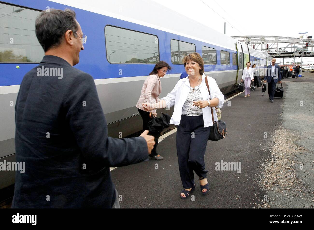French Socialist Party first secretary Martine Aubry is welcomed by her special advisor Francois Lamy as she arrives by train to the station of La Rochelle, western France on August 26, 2010. Aubry came to open the Socialist Party's annual summer camp. Photo by Patrick Bernard/ABACAPRESS.COM Stock Photo