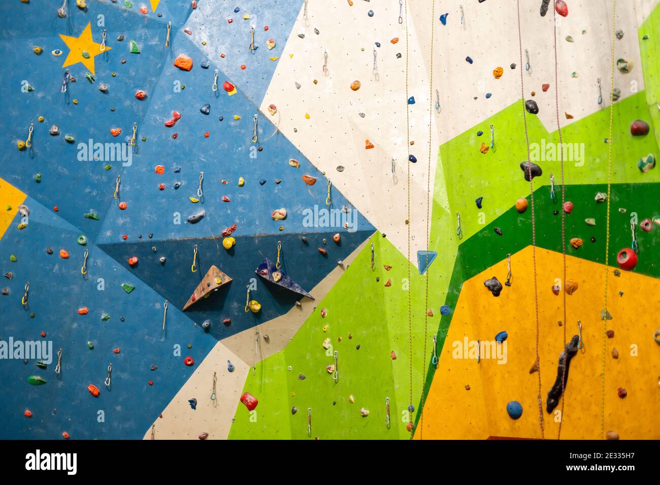 A rock climbing wall for background Stock Photo - Alamy