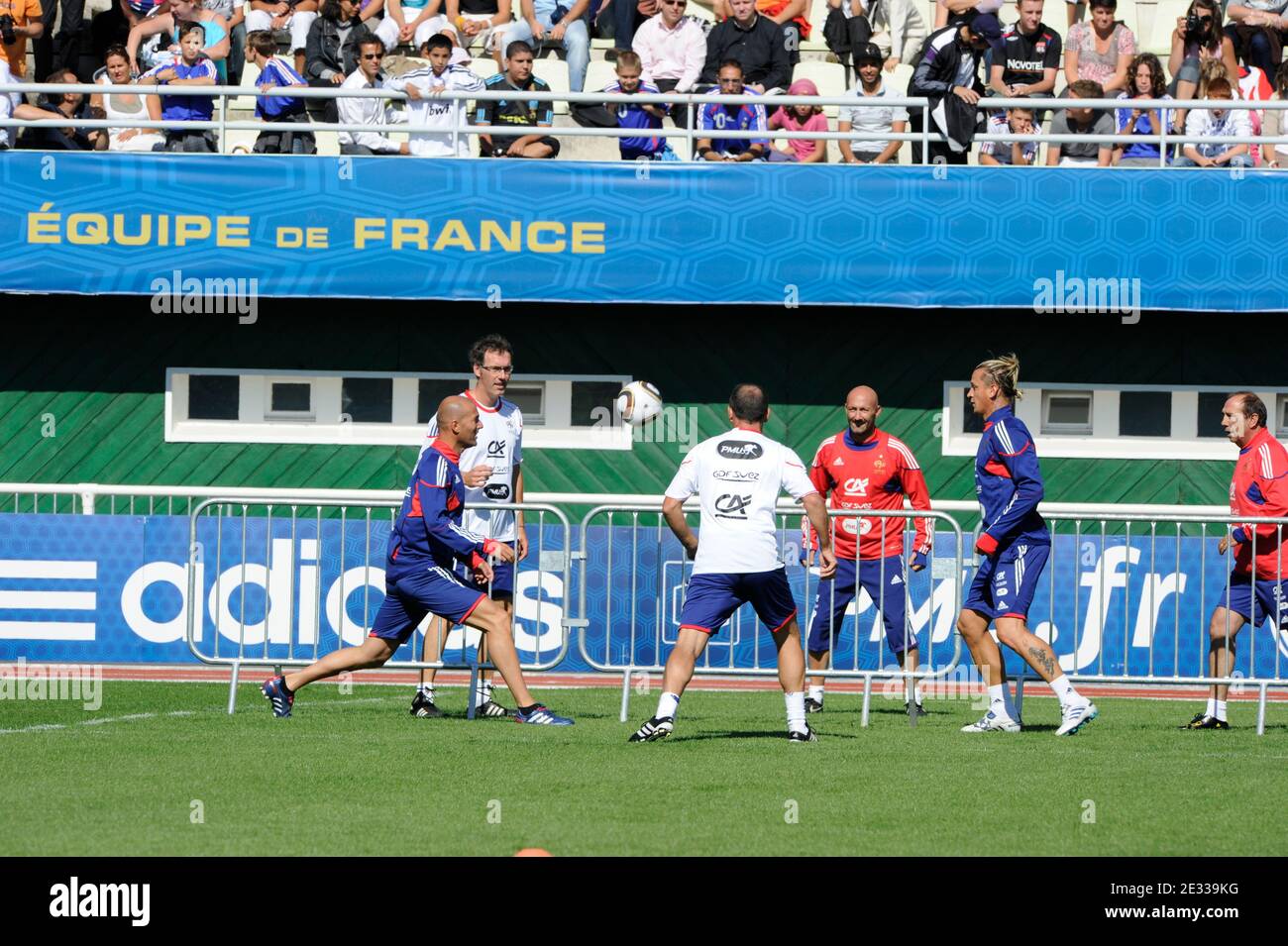 Former French Soccer Player Zinedine Zidane With Laurent Blanc Coach Of The France National Football Team And Fabien Barthez Assistant Goalkeeper Coach And Playeraephilippe Mexes Attend The Training Of The National National