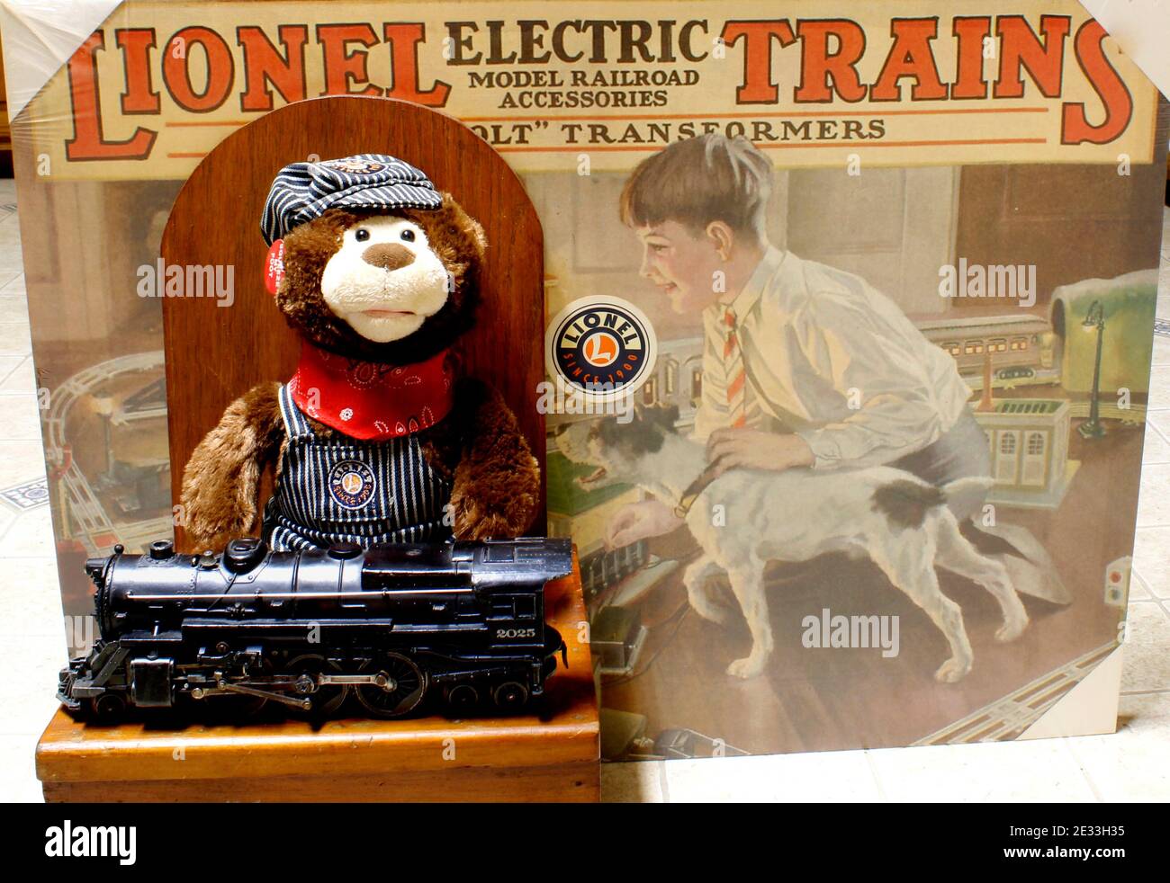 The photo depicts Lionel advertising, a teddy bear engineer, along with a 2025 Lionel steam engine. Stock Photo