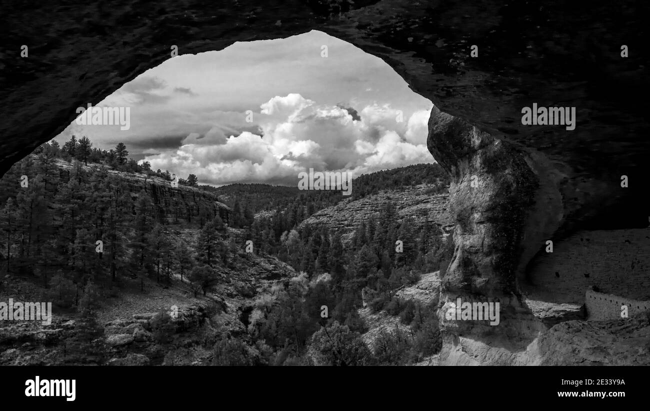 Dramatic sky looking out from the inside of one of the caves at the Gila Cliff Dwellings National Monument near Silver City, New Mexico Stock Photo