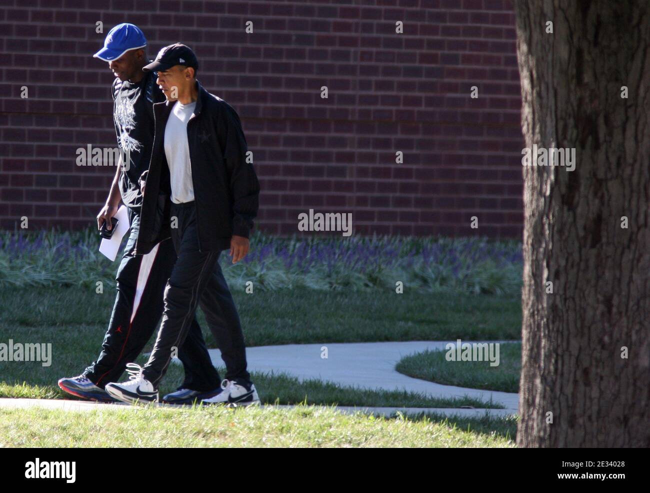 President Barack Obama walks with his personal aide, Reggie Love, as the two arrive at Fort Leslie J. McNair's athletic facility for a morning game of basketball in Washington, DC, USA on September 18, 2010. Photo by Martin H. Simon/ABACAPRESS.COM (Pictured: Barack Obama, Reggie Love) Stock Photo