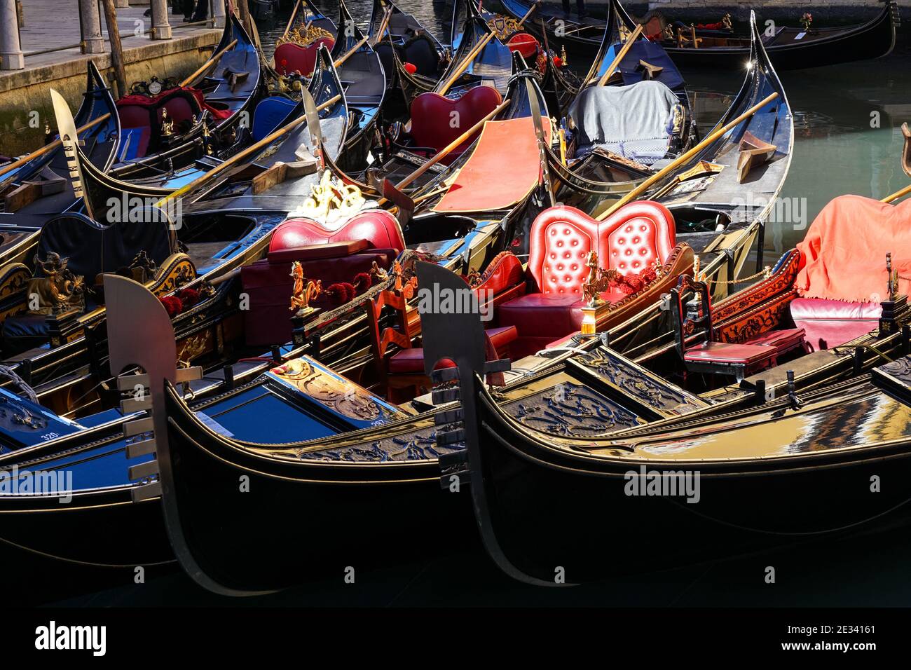 Traditional Venetian gondola, Venetian gondolas on canal in Venice, Italy Stock Photo