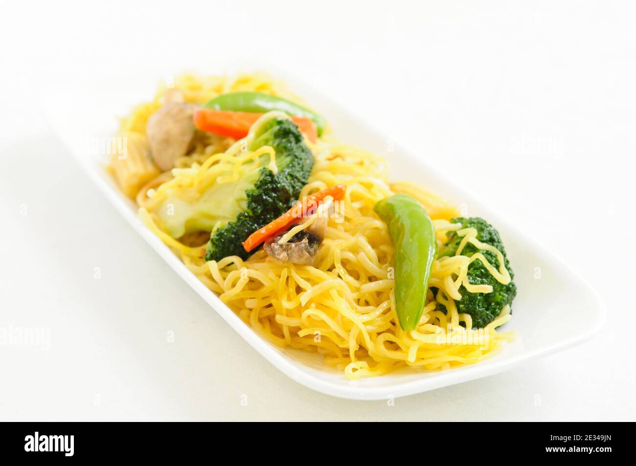Isolated shot of a tasty dish with pasta and vegetables Stock Photo