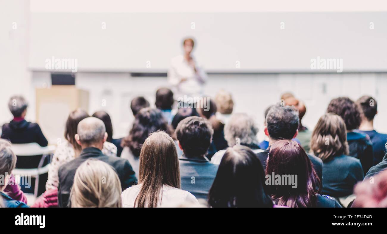 Woman giving presentation on business conference Stock Photo - Alamy