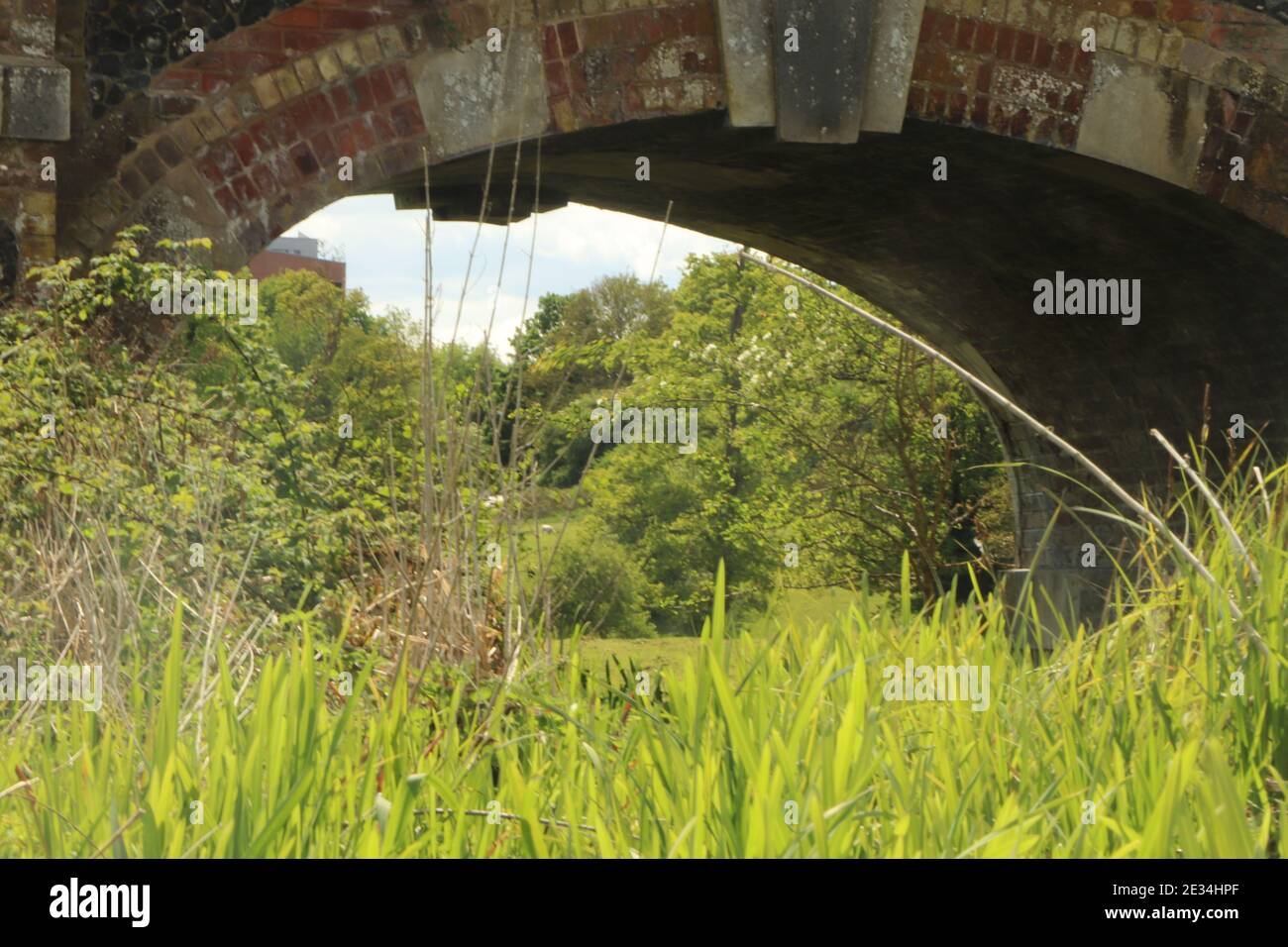 Solid brickwork of a bridge across a stream Stock Photo - Alamy