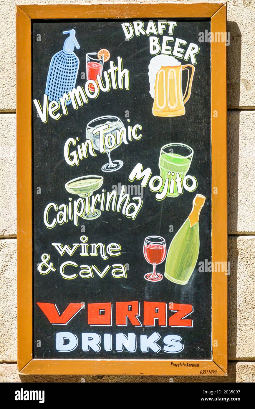 Spain Barcelona Hispanic Catalonia Catalunya El Born historic district Ciutat Vella bar exterior painted drink menu vermouth beer gin caipirinha mojit Stock Photo
