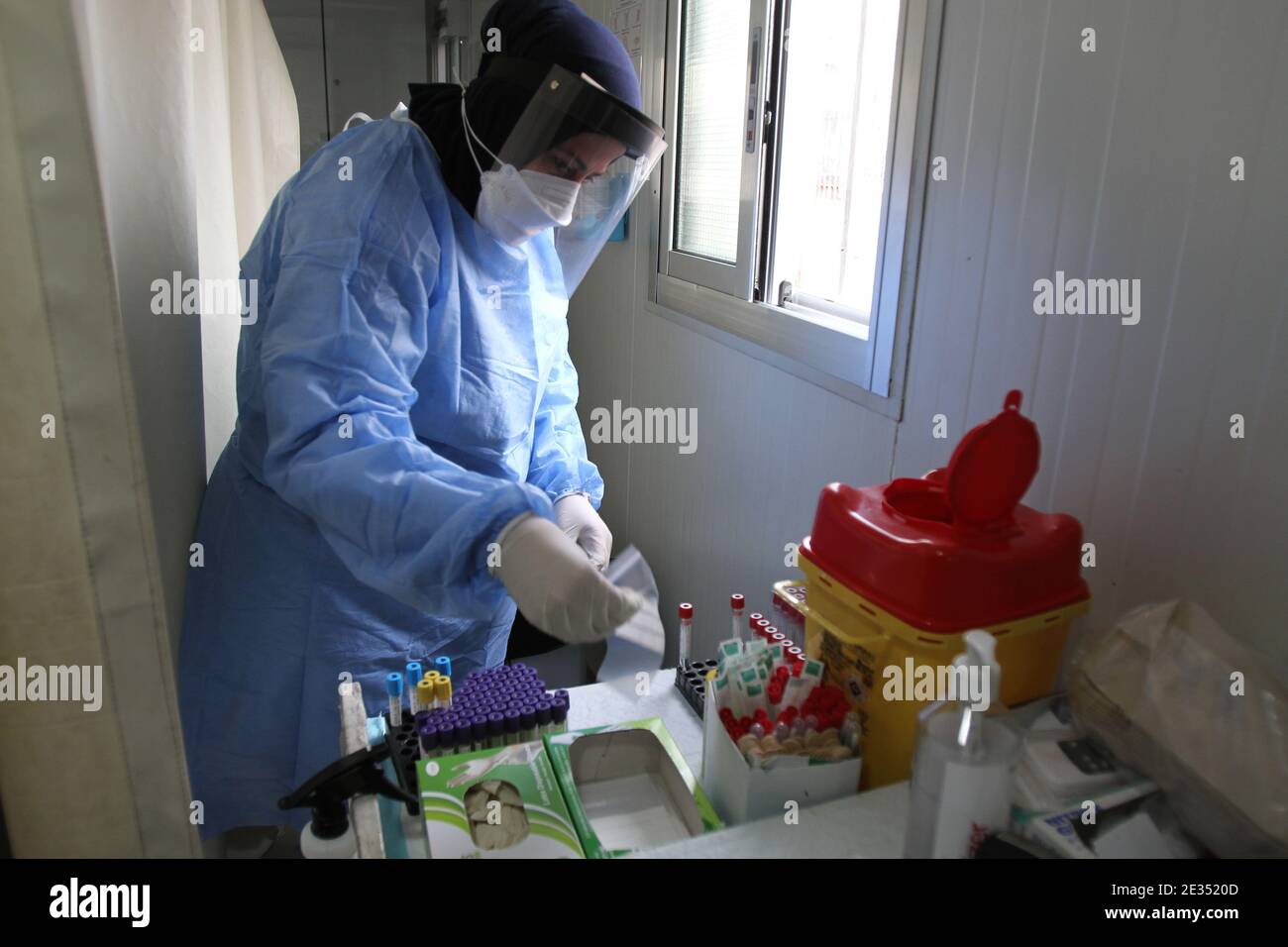 Tripoli, Lebanon. 16th Jan, 2021. A nurse prepares for a COVID-19 test at a hospital in Tripoli, Lebanon, Jan. 16, 2021. Lebanon registered on Saturday 5,872 new COVID-19 infections, bringing the total number of cases in the country to 249,158. Credit: Khaled/Xinhua/Alamy Live News Stock Photo