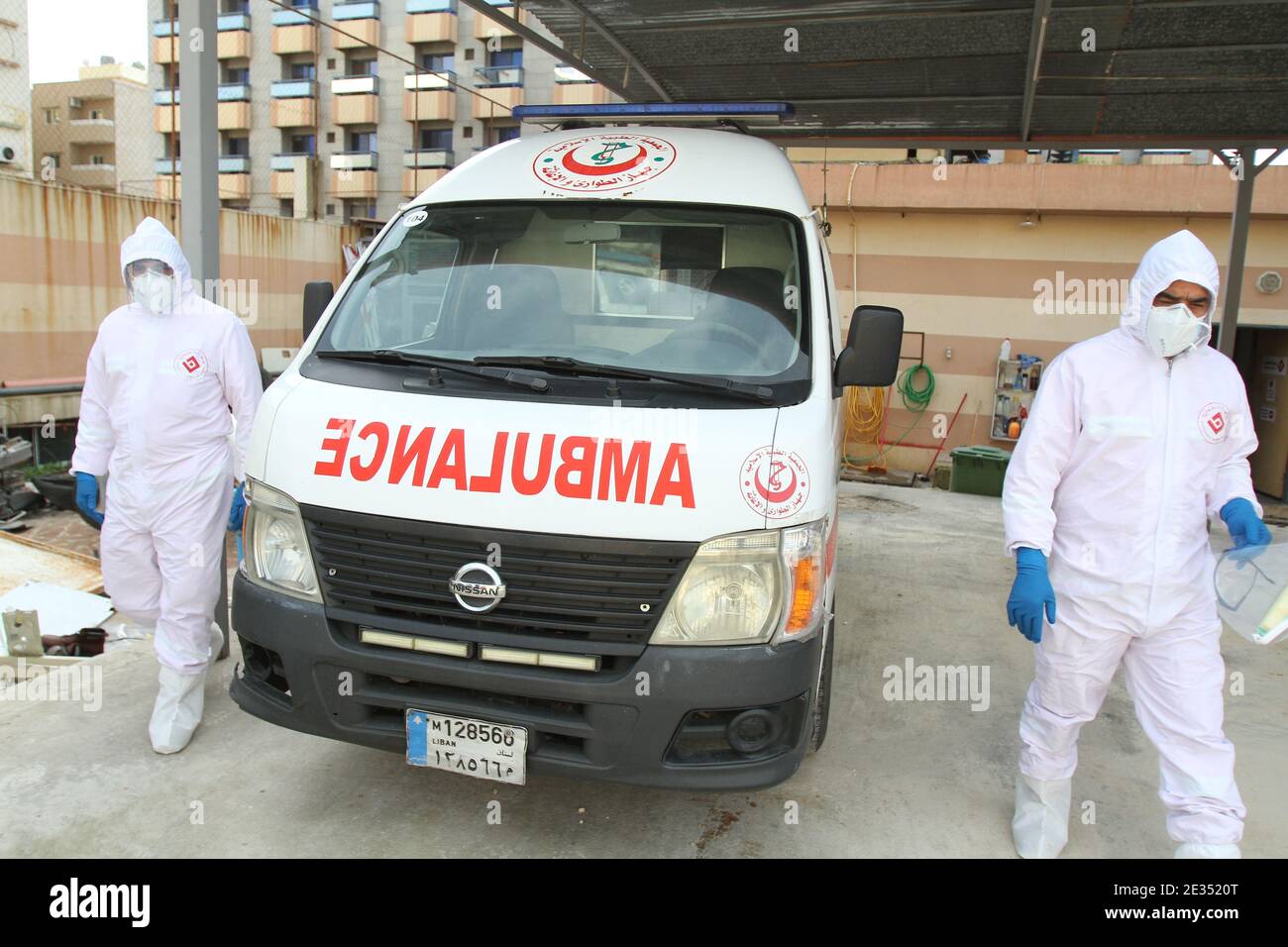 Tripoli, Lebanon. 16th Jan, 2021. Medical workers are seen beside an ambulance in Tripoli, Lebanon, Jan. 16, 2021. Lebanon registered on Saturday 5,872 new COVID-19 infections, bringing the total number of cases in the country to 249,158. Credit: Khaled/Xinhua/Alamy Live News Stock Photo