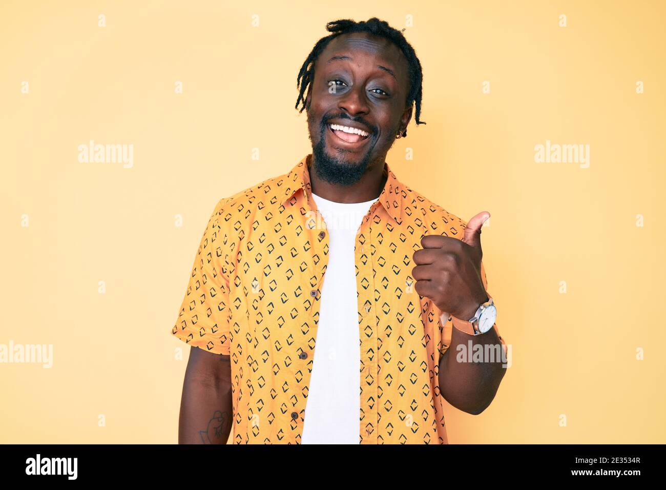 Young african american man with braids wearing casual clothes smiling ...