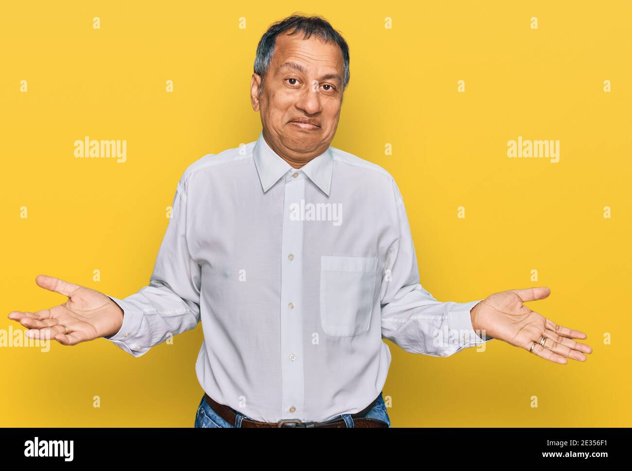 South indian man standing arms hi-res stock photography and images - Alamy