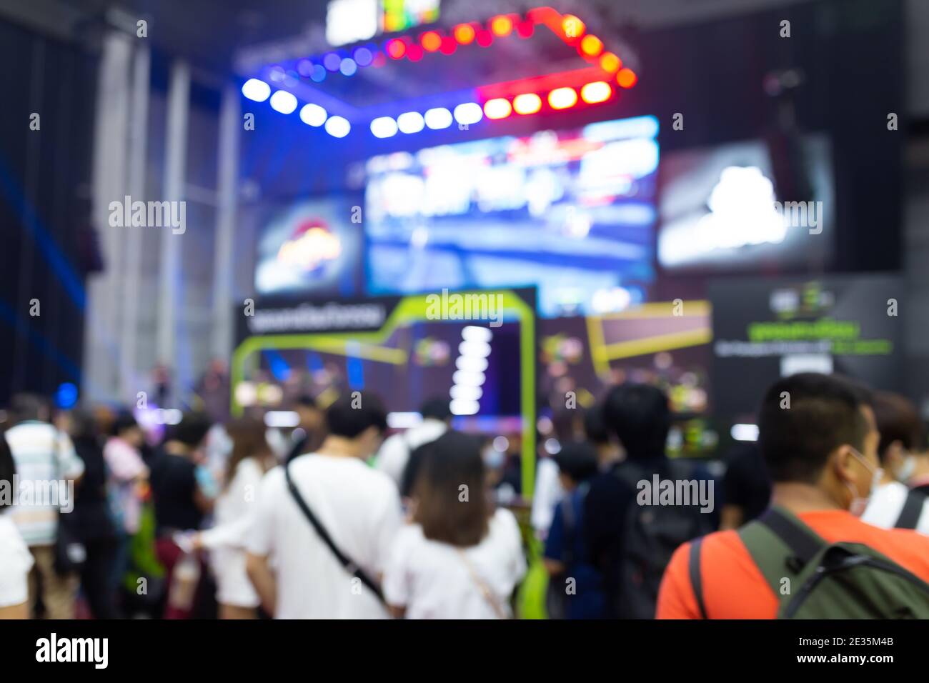 Abstract blur people in exhibition hall event computer game show festival background. Stock Photo