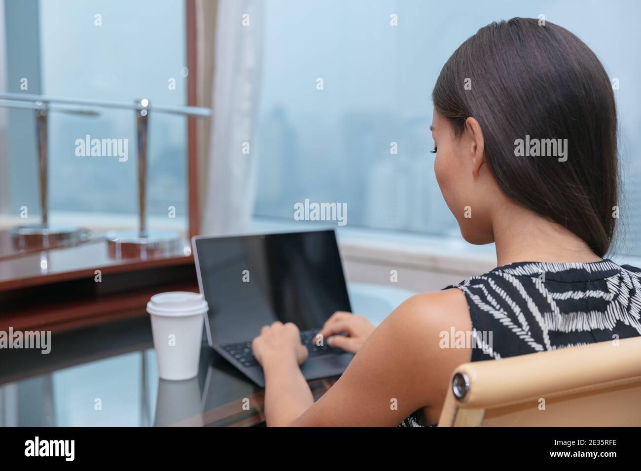 Remote work at home or on business trip travel young lady working 