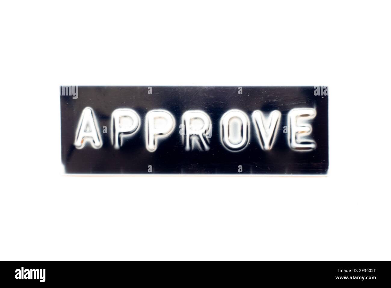 Embossed letter in word approve on black banner with white background Stock Photo