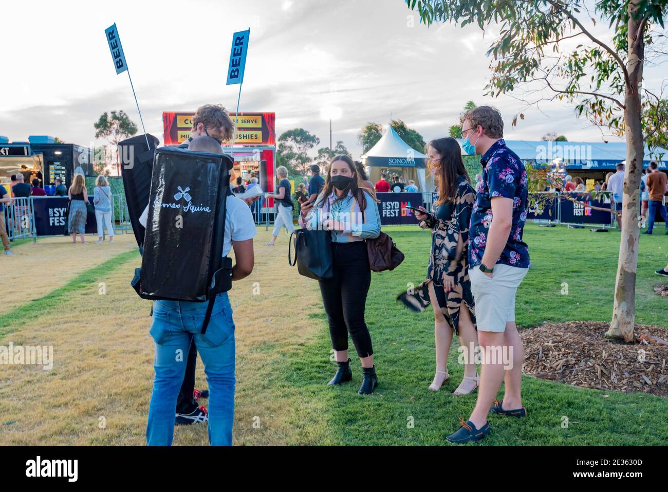 People buying beer at The Uncertain Four Seasons concert at Barangaroo Headland as part of the annual Sydney Festival in Australia Stock Photo