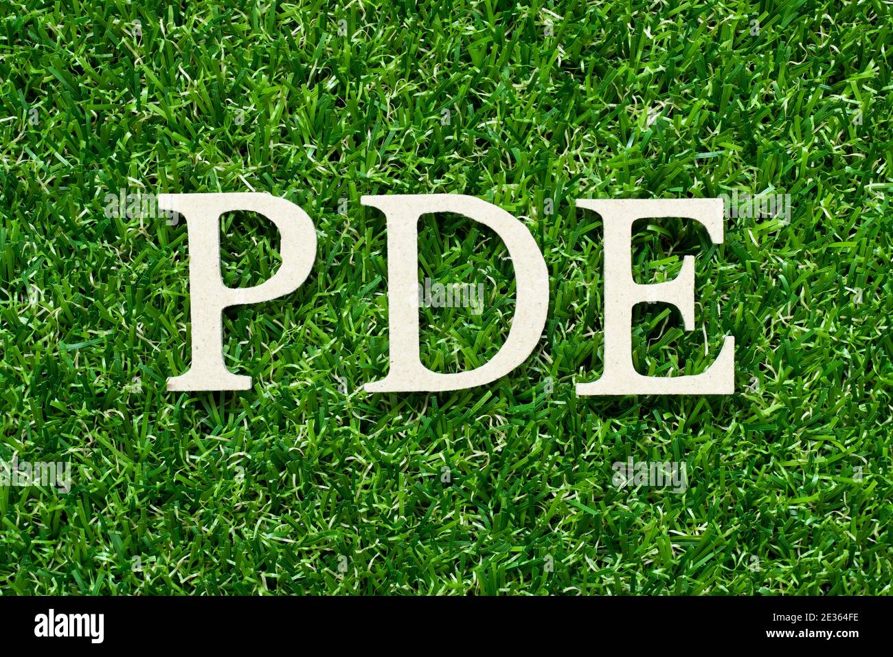 Wood alphabet letter in word PDE (abbreviation of permitted daily exposure,  partial differential equation or personal development education) on green  Stock Photo - Alamy