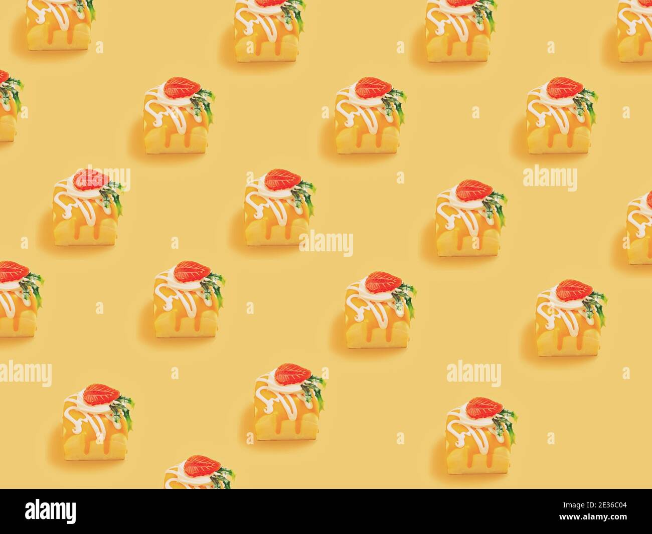Minimal  concept.Trendy Candy pattern made with various  candy bright light yellow background Stock Photo