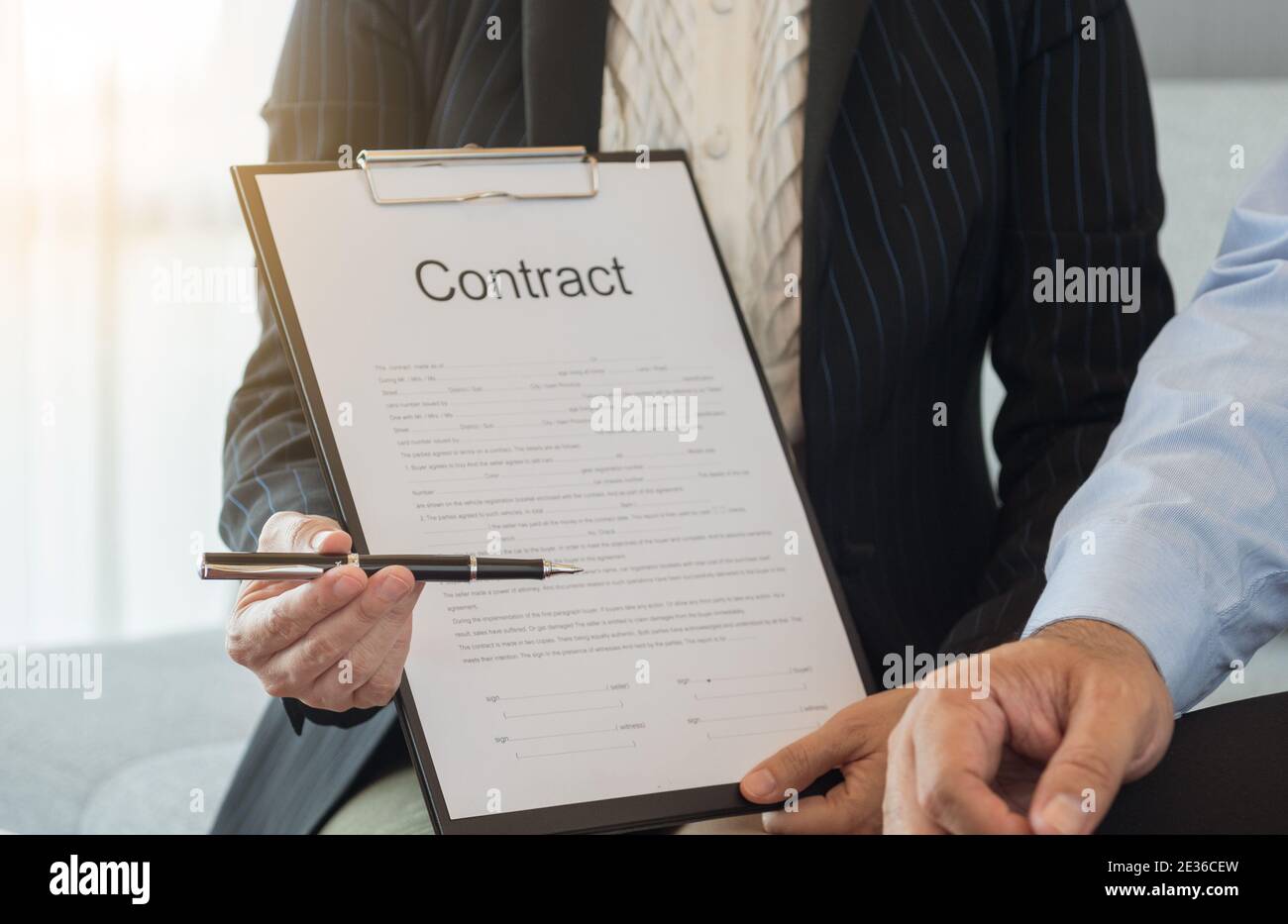 Signing important business document contract hi-res stock photography ...