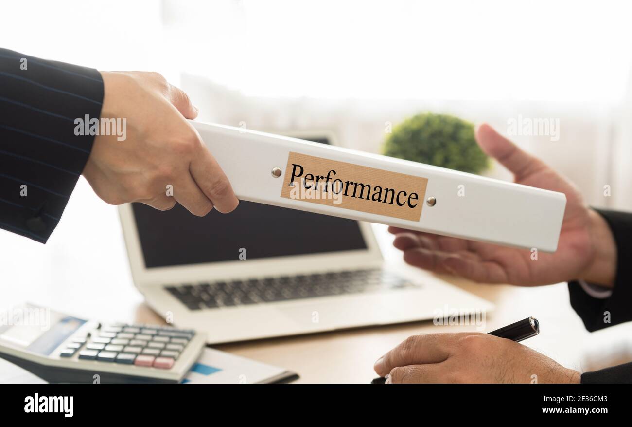 staff sending performance management file to the executives. select focus. Stock Photo