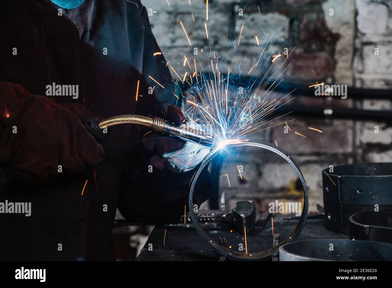Gas metal arc welding, sparks and blue glow close-up Stock Photo - Alamy