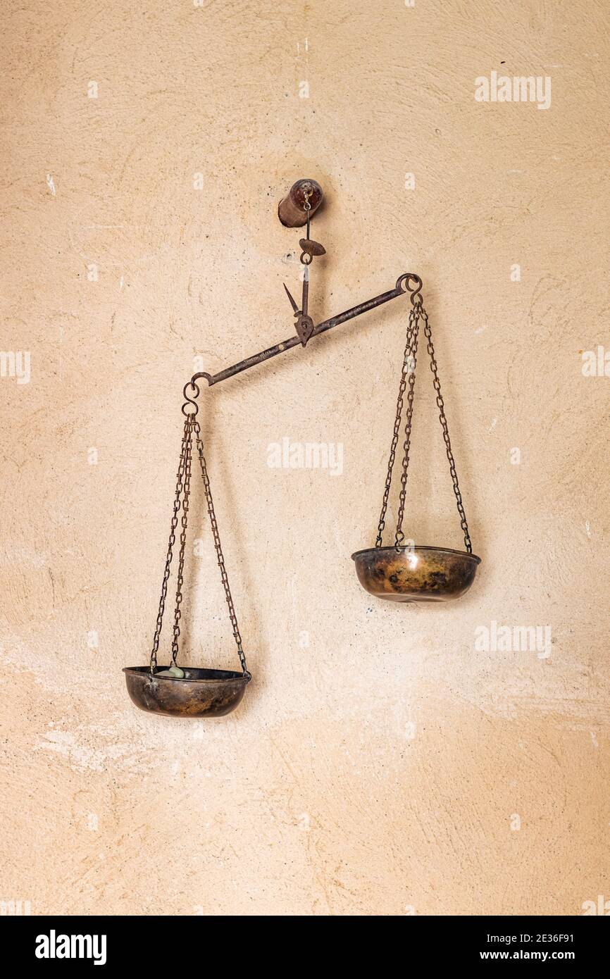 Scale haning on a wall in an old castle in Oman Stock Photo