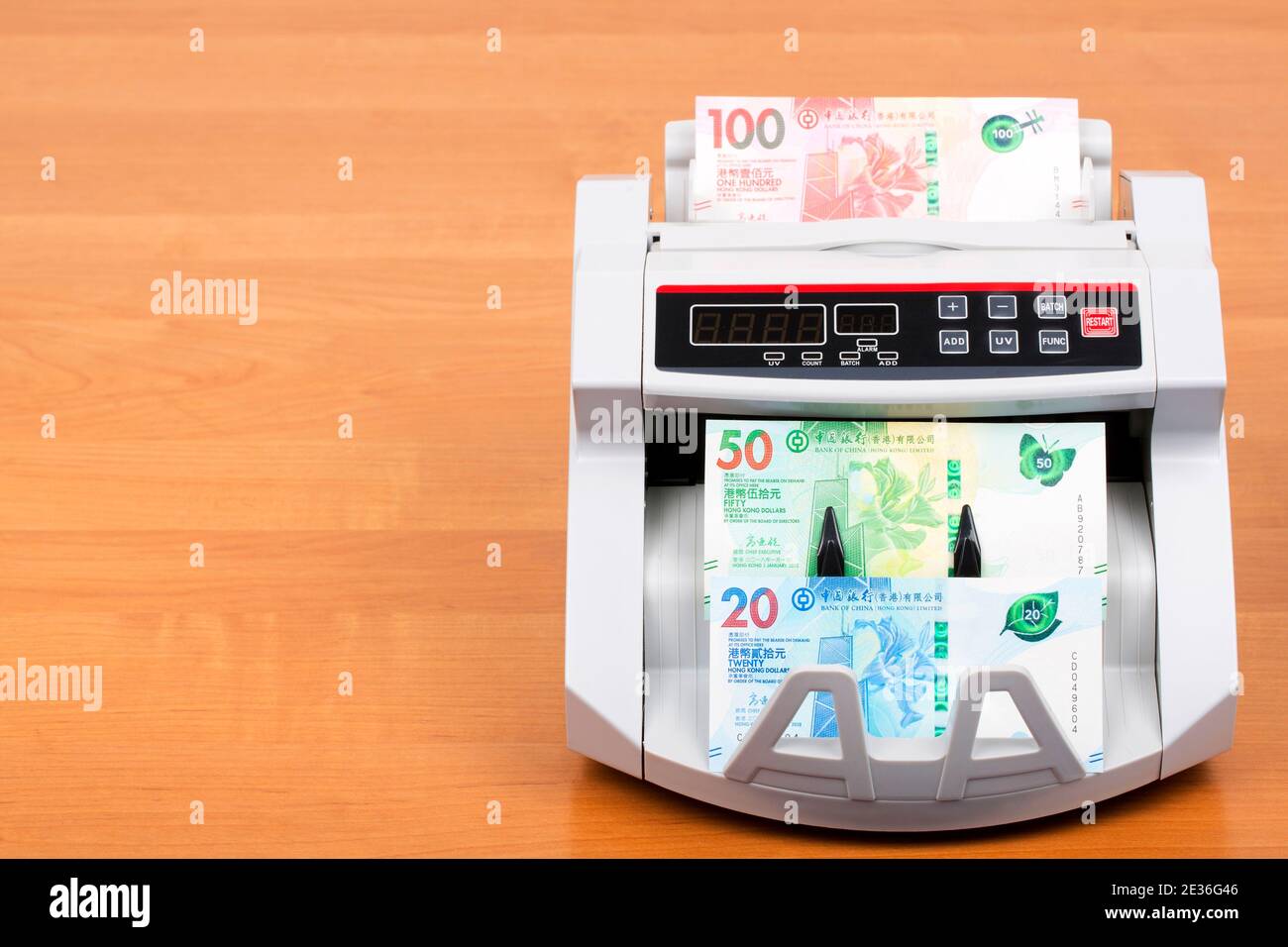 Hong Kong Dollar in the counting machine Stock Photo Alamy