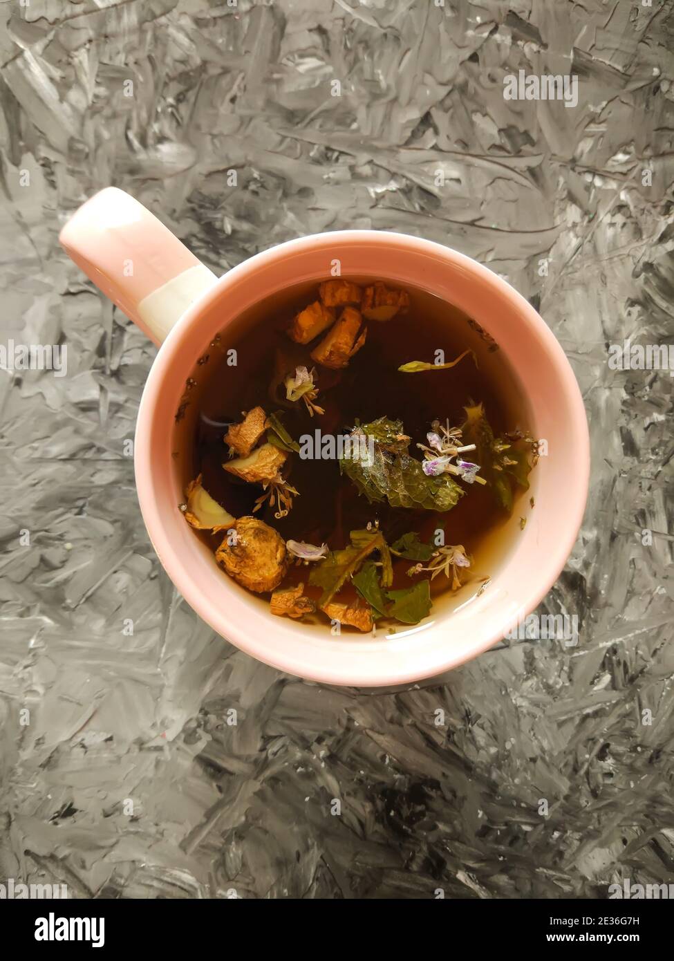 Natural herbal tea with medical herbs in ceramic cup Stock Photo