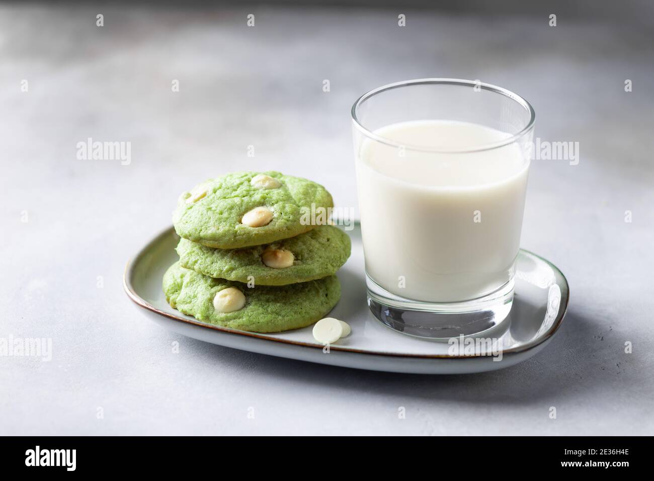 green tea matcha cookies and glass with non dairy milk Stock Photo