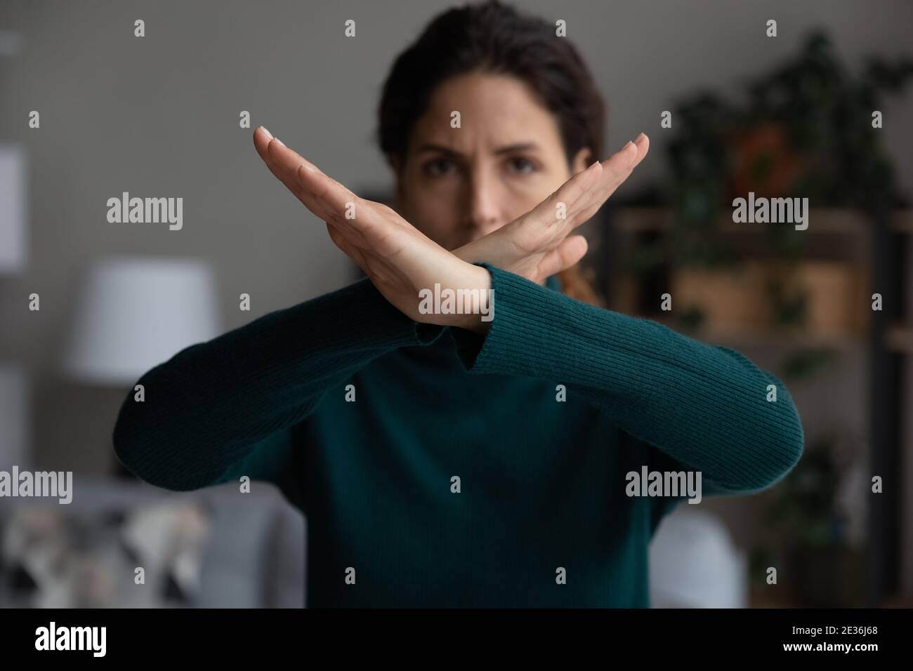 Determined young woman show no hand gesture Stock Photo