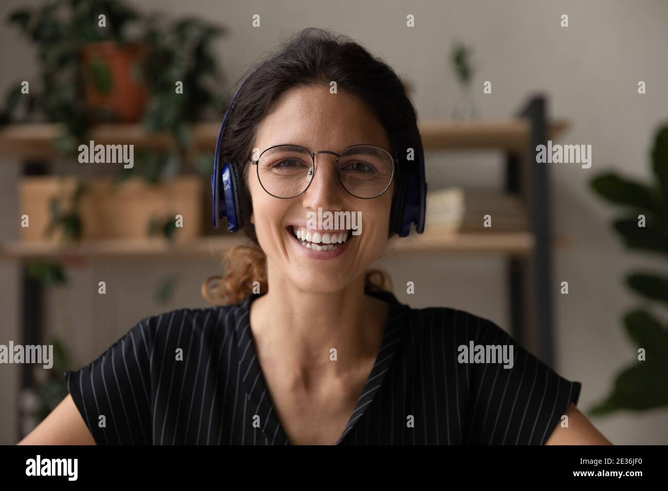 picture of happy woman in headphones over white Stock Photo - Alamy