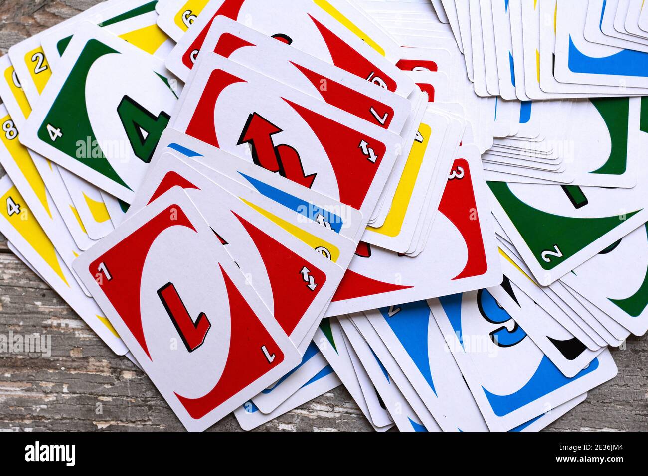 Deck of Uno Game Cards Scattered All Over on a Table. American