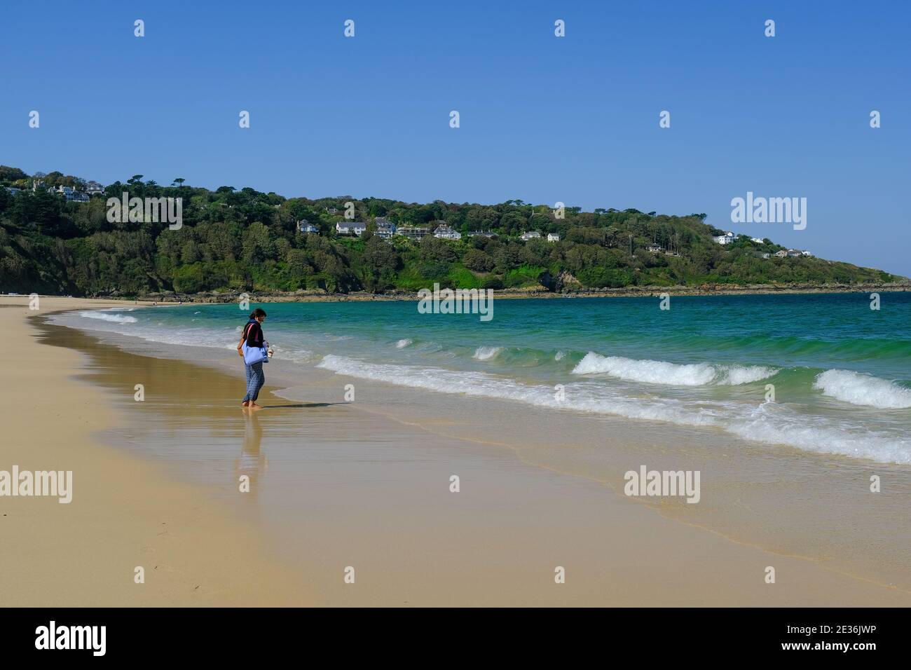 Woman on beach at Carbis Bay close t St Ives in Cornwall, UK. Stock Photo