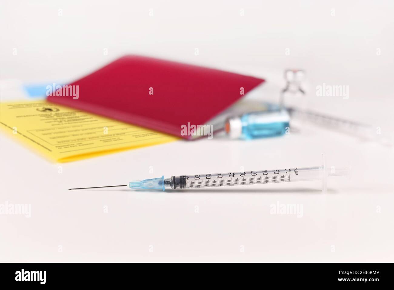 Travel restrictions concept for people without corona virus vaccination with syringe and certificate of vaccination and travel passport Stock Photo