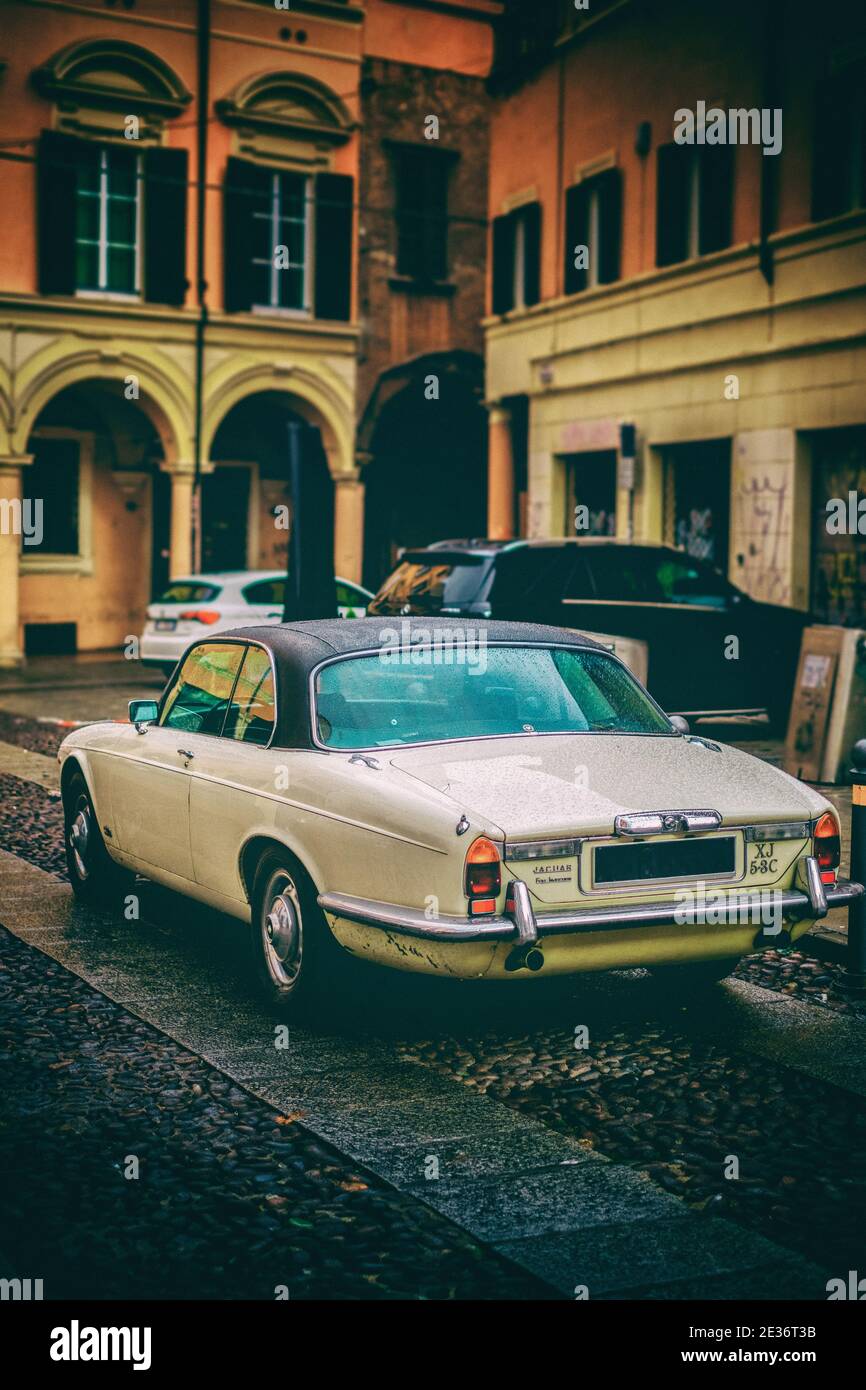 vintage jaguar car in vertical colorful vignette antique background Stock Photo