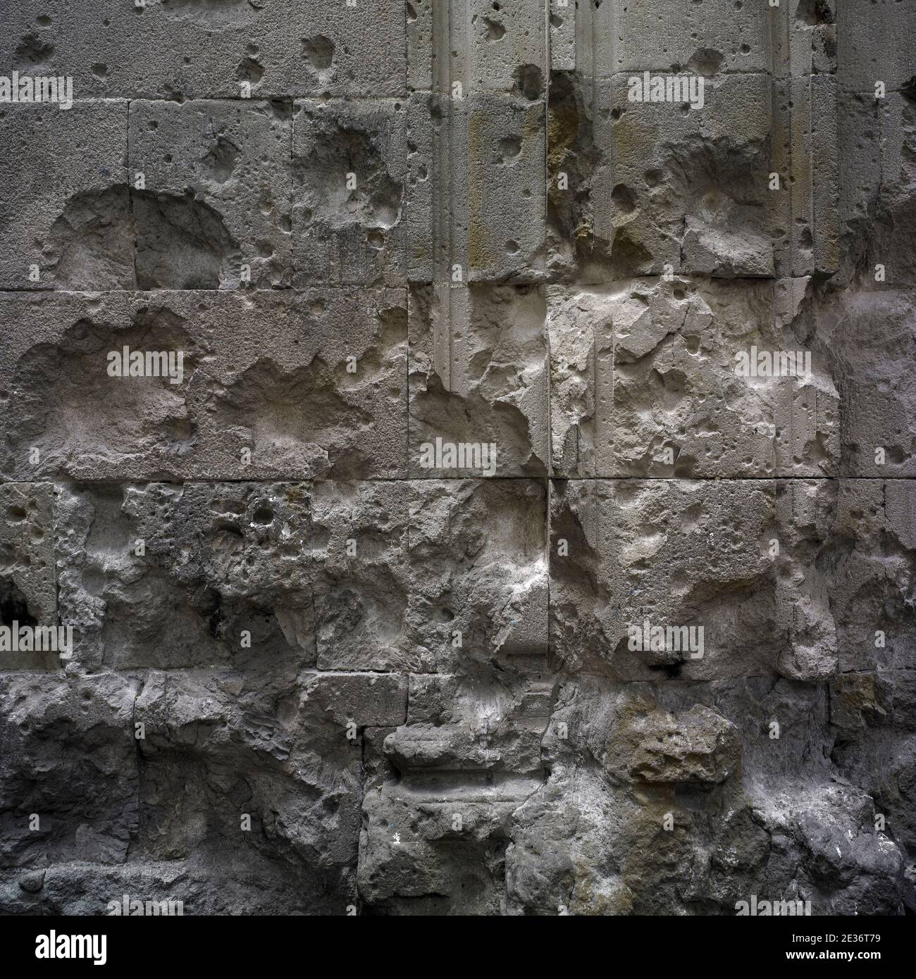 War damage. Shrapnel marks against ancient wall. Remains of Spanish Civil war at Barcelona city. Stock Photo