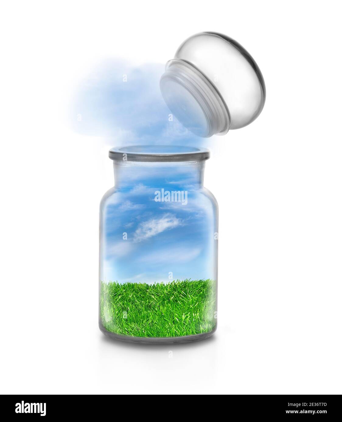 Landscape with grass inside a chemical bottle on white background and flying stopper. Frendly sky flowing outside. Funny ecological and sustainable co Stock Photo