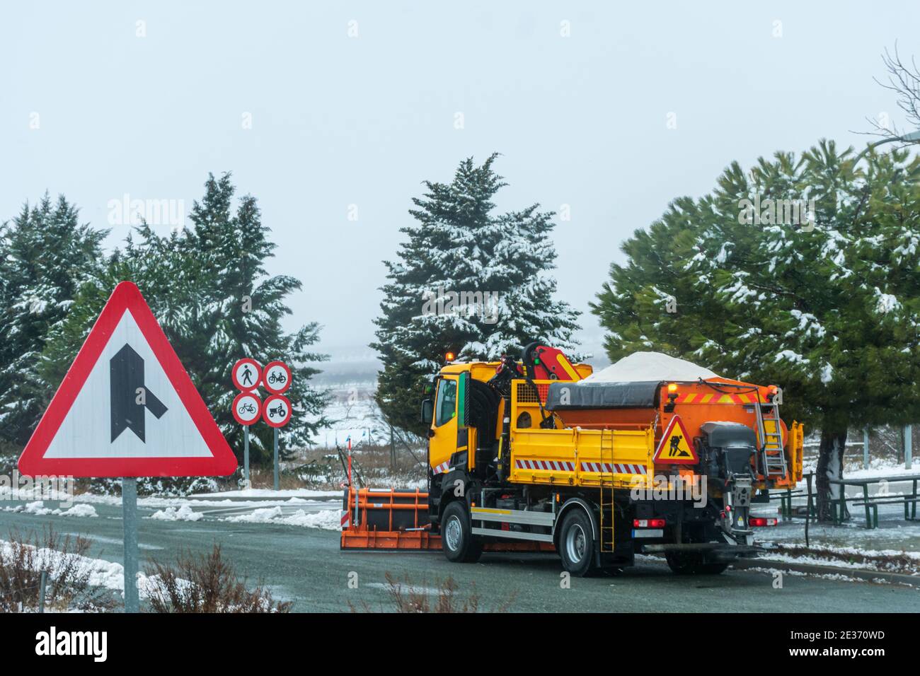 Snow plow truck loaded with salt to throw it on the road and avoid ice