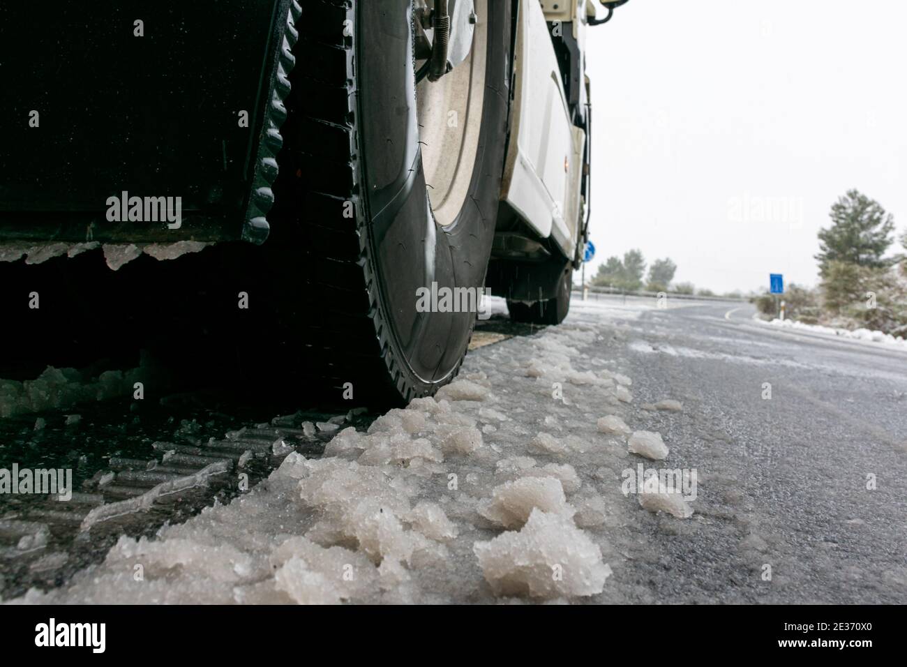 Ground level view of truck wheels on snow. Stock Photo