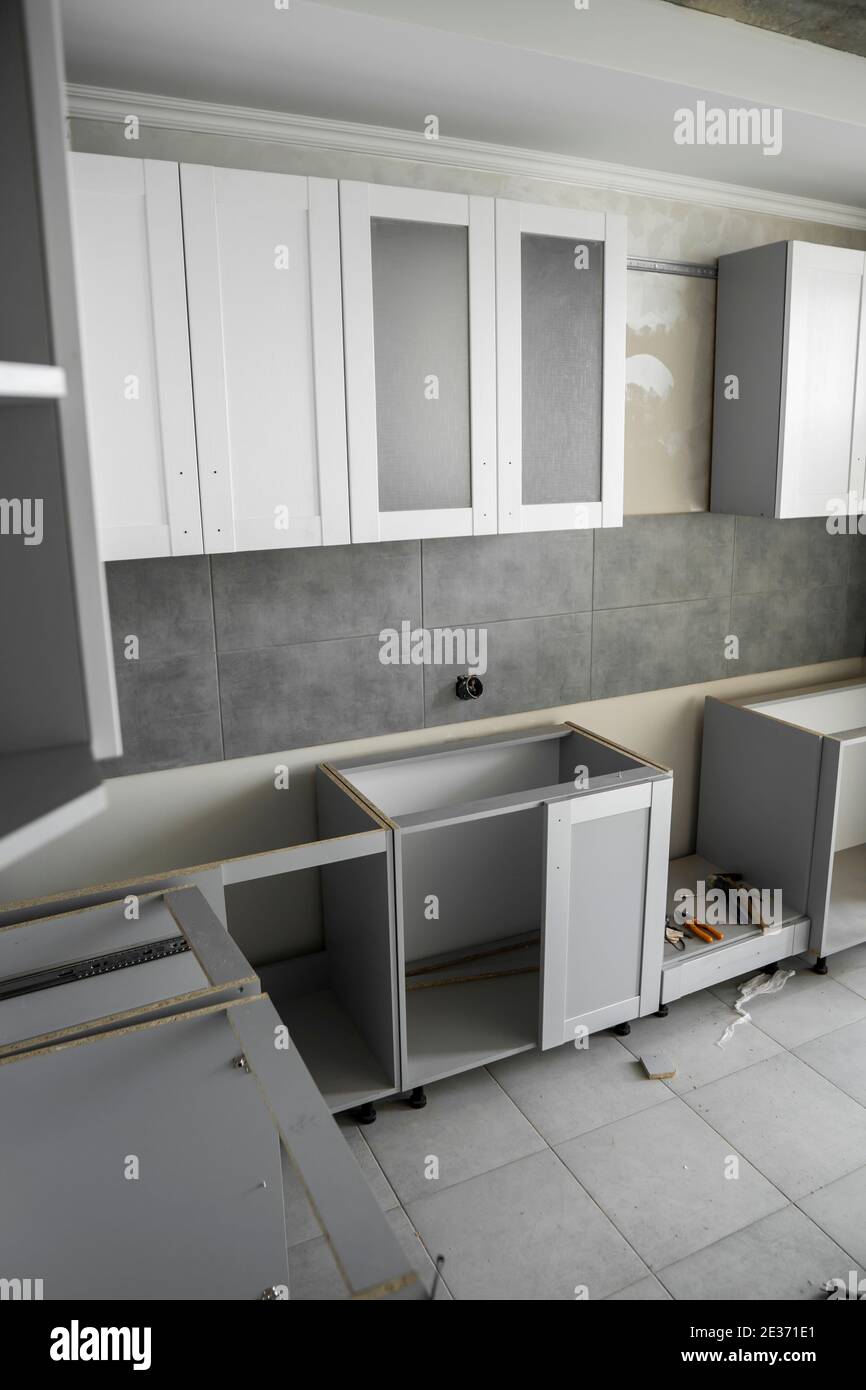 Custom kitchen installation with a furniture facades mdf. Gray